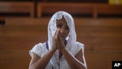 A Catholic woman attends Mass at the Metropolitan Cathedral in Managua, Nicaragua, Feb. 12, 2023. Pope Francis expressed worry that Bishop Roland Alvarez was sentenced to 26 years.
