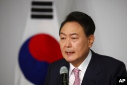 South Korea's president-elect Yoon Suk Yeol speaks during a news conference at the National Assembly in Seoul, South Korea, March 10, 2022.