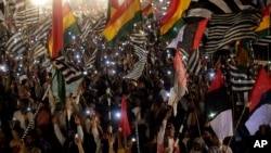 Supporters of opposition groups take part in anti-government rally in Islamabad, Pakistan, March 28, 2022.