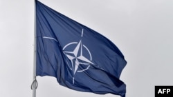 FILE - A flag of the North Atlantic Treaty Organization flies at its headquarters in Brussels on Nov. 16, 2022. 