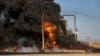 Smoke rises from an oil depot struck by the Turkish air force near Qamishli, Syria, Nov. 23, 2022. Turkey this week launched airstrikes on suspected Kurdish rebels hiding in neighboring Syria and Iraq, in retaliation for a bombing in Istanbul blamed on Kurdish groups. 