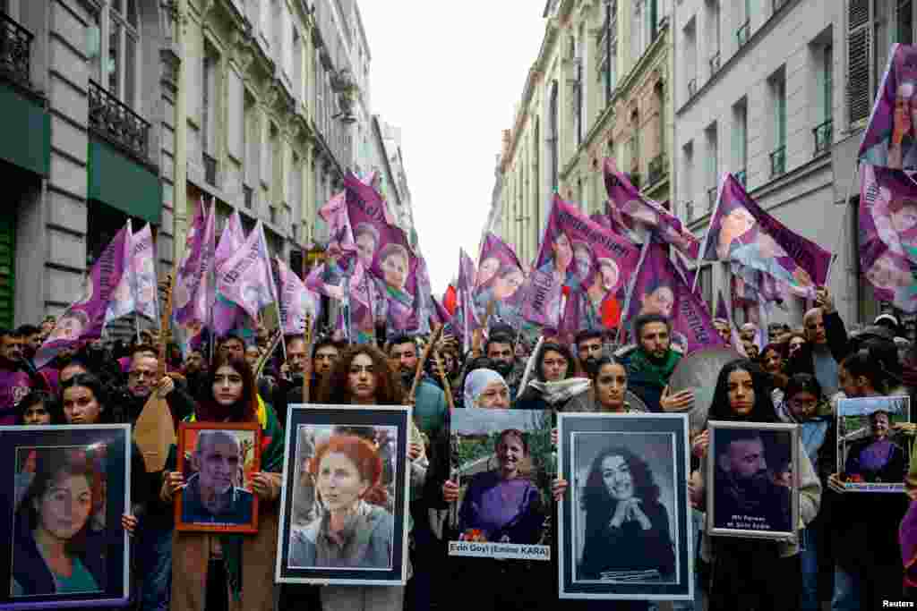 Members of the Kurdish community attend a march organized by the Kurdish Democratic Council in France (CDK-F) in tribute to the victims of Friday's deadly attack, in Paris, France.