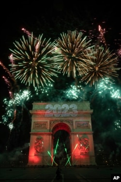 A sound and light show is projected on the Arc de Triomphe during New Year celebrations in Paris, France, Jan. 1, 2023.