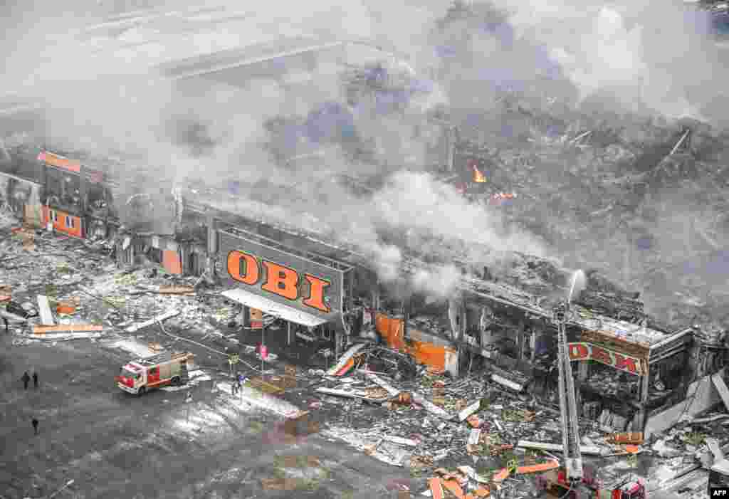Russia firefighters battle a massive blaze the size of a football pitch which broke out overnight at the Mega Khimki shopping and entertainment center in Moscow's northern suburb of Khimki. Russian media later reported that one person had been killed in the fire. 