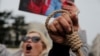 Members of the Iranian community living in Turkey attend a protest in Istanbul, in support of Iranian women, after the death of Mahsa Amini, Dec. 13, 2022. Iran's Supreme Court accepted an appeal by rapper Saman Seydi Yasin against his death sentence, Dec. 24, 2022.
