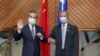 FILE - In this photo released by Xinhua News Agency, Secretary-General Pacific Islands Forum Secretariat Henry Puna, right, and visiting Chinese Foreign Minister Wang Yi pose for a photo before their meeting in Suva, Fiji, Sunday, May 29, 2022.