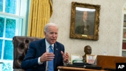 FILE - U.S. President Joe Biden speaks during an interview in the Oval Office of the White House, in Washington, June 16, 2022. 