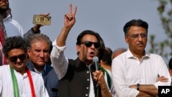 FILE - Pakistan’s former Prime Minister Imran Khan, center, speaks during a rally in Islamabad, May 26, 2022. 
