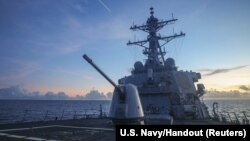 Arleigh Burke-class guided-missile destroyer USS Benfold (DDG 65), forward-deployed to the U.S. 7th Fleet area of operations, conducts underway operations in the South China Sea, in this handout picture released on July 13, 2022. 