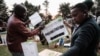 Presiding officers check electoral material at the tallying center in Kilgoris, Kenya, Aug. 8, 2022.
