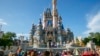 FILE - Performers entertain visitors at Walt Disney World Resort in Lake Buena Vista, Florida, April 18, 2022. Disney has filed a lawsuit against the state's governor, claiming he and his administration violated the company's First Amendment rights.