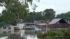 FILE - Buildings are surrounded by flood waters in Londonderry on the outskirts of Sydney, Australia, March 3, 2022.
