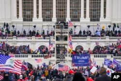 FILE - Insurrectionists loyal to President Donald Trump breach the Capitol in Washington, Jan. 6, 2021.
