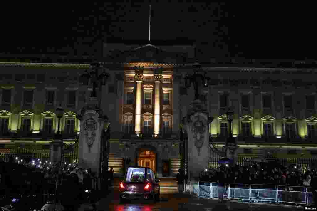 The hearse carrying the coffin of Queen Elizabeth arrives at Buckingham Palace, following her death, in London, Sept. 13, 2022.
