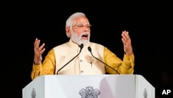 Indian Prime Minister Narendra Modi speaks at the inauguration of the revamped Central Vista Avenue at the India Gate in New Delhi, India, Sept. 8, 2022. 