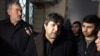 FILE - Avaz Zeynalli, center, owner and chief editor of the independent news outlet Xural TV, is seen in this undated photo.