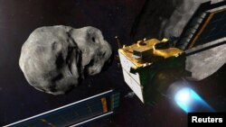 NASA's Double Asteroid Redirection Test (DART) spacecraft prior to impact at the Didymos binary asteroid system showed in this undated illustration handout. (NASA/Johns Hopkins/Handout via Reuters) 