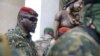 FILE - Guinea's Junta President Col. Mamady Doumbouya leaves a meeting with an ECOWAS delegation in Conakry, Guinea, Sept. 10, 2021.