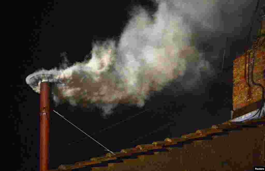 &quot;I just want him to do what the other pope didn&rsquo;t do. Where [Benedict XVI] stopped, let [Francis] start...&quot; Zaituni Mahmoud, Gudele, Juba White smoke rises from the chimney on the Sistine Chapel indicating that a new pope has been elected at the Vatican, March 13, 2013. 