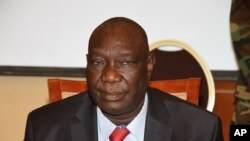 Michel Djotodia, the rebel leader who declared himself president over the weekend after his soldiers seized the capital, meets with members of the government armed forces, in Bangui, Central African Republic, March 28, 2013.