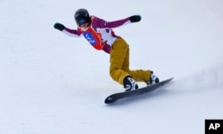 FILE - Lindsey Jacobellis from the U.S. competes to win the snowboard cross event at the Freestyle Ski and Snowboard World Championships in Kreischberg, Austria, Jan. 16, 2015.