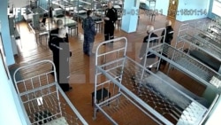 FILE - A still image from CCTV footage published by Life.Ru shows what is said to be jailed Kremlin critic Alexey Navalny speaking with a prison guard at the IK-2 corrective penal colony in Pokrov, Russia, in this image released Apr. 2, 2021.