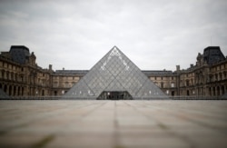 A view shows the deserted area in front of the glass Pyramid of the Louvre museum in Paris as a lockdown is imposed to slow the rate of the coronavirus disease (COVID-19) in France, March 18, 2020.
