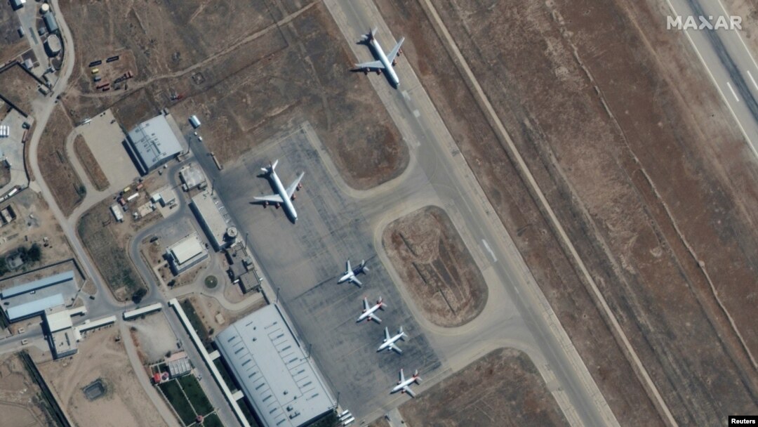 FILE - Several commercial airplanes are seen near the main terminal of the Mazar-i-Sharif airport, in northern Afghanistan, Sept. 3 2021. (Maxar Technologies/Handout via Reuters).