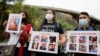 FILE - People protest in front of the Bolivarian National Intelligence Service (SEBIN) headquarters, seeking freedom for political prisoners during the visit of the International Criminal Court's Prosecutor Karim Khan, in Caracas, Venezuela, Nov. 3, 2021.