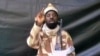 FILE - A grab made on July 13, 2013 from a video obtained by AFP shows the leader of the Islamist extremist group Boko Haram Abubakar Shekau, dressed in camouflage and holding an Kalashnikov AK-47. 