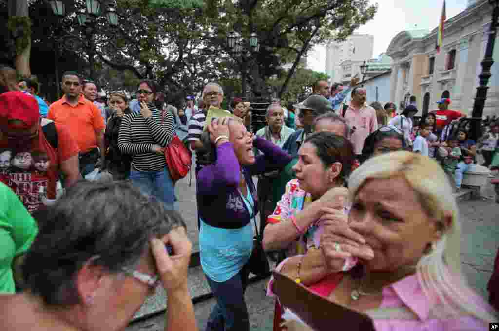 Chavez supporters react after his death was announced, Caracas, Venezuela, March 5, 2013.