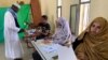 FILE - A man attends voting at a polling station during presidential election in Nouakchott, Mauritania, June 22, 2019. 