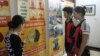 Vicky (right) Vanessa and Wiesenmaier visit Education for Nature - Vietnam, a conservation organization in Hanoi during their campaign to discourage Vietnamese people from buying products made from rhino horn.