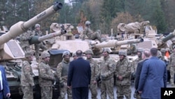 FILE - U.S. Secretary of State Mike Pompeo talks to U.S. soldiers based in Grafenwoehr, Germany, Nov. 7, 2019.