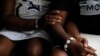 Same-sex couple, Naa Shika, 37, and her partner Kay, 27, sit together in Accra, Ghana. Jan. 23, 2024.