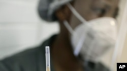 A medical staff member prepares a syringe, at the Chris Hani Baragwanath hospital in Soweto, Johannesburg, June 24, 2020.