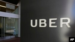 FILE - An exterior view of the headquarters of Uber is seen in San Francisco, March 1, 2017. Toyota will sink a half-billion dollars into Uber and work jointly with the ride-hailing giant to develop self-driving vehicles. 