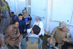 Afghan journalist Storai Karimi, top, reports from Afghanistan in this undated photo. (Photo courtesy of Storai Karimi)