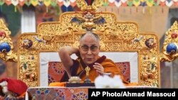 Tibetan spiritual leader the Dalai Lama addresses devotees on the first day of Kalachakra in Bodhgaya, India, Jan. 2, 2017.