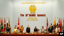 FILE - South Asian leaders stand during the 18th summit of the South Asian Association for Regional Cooperation (SAARC) in Katmandu, Nepal, Nov. 26, 2014.