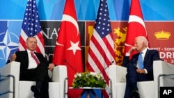 President Joe Biden, right, meets with Turkey's President Recep Tayyip Erdogan during the NATO summit in Madrid, June 29, 2022.