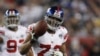 FILE - In this Feb. 3, 2008, file photo, New York Giants defensive end Osi Umenyiora (72) holds up the ball after a fumble recovery in the second quarter during Super Bowl XLIl.