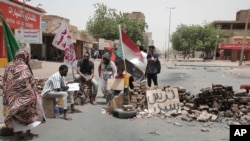 People stage a sit-in demanding a return to civilian rule and to protest the killing nine people in anti-military demonstrations last month, in Khartoum, Sudan, July 4, 2022.