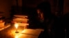 People have again resort to candlelight as power outages become common in Bangladesh. (Photo by Nazmul Islam)