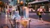 A health worker waits to test people for the Covid-19 on a street in a residential area in the Jing'an district of Shanghai on July 5, 2022