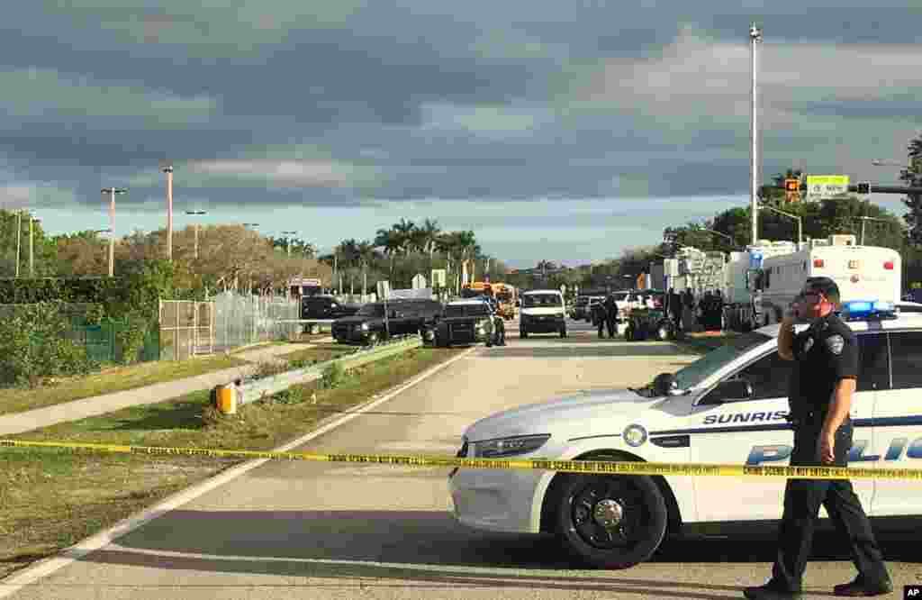 Police patrol the area outside Marjory Stoneman Douglas High School following a school shooting incident in Parkland, Florida, U.S., February 15, 2018.