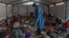 FILE - Doctor Robert Musole, medical director of the Kavumu hospital, visits patients recovering from mpox in the village of Kavumu, 30 kilometers north of Bukavu in eastern Democratic Republic of Congo on Aug. 24, 2024.