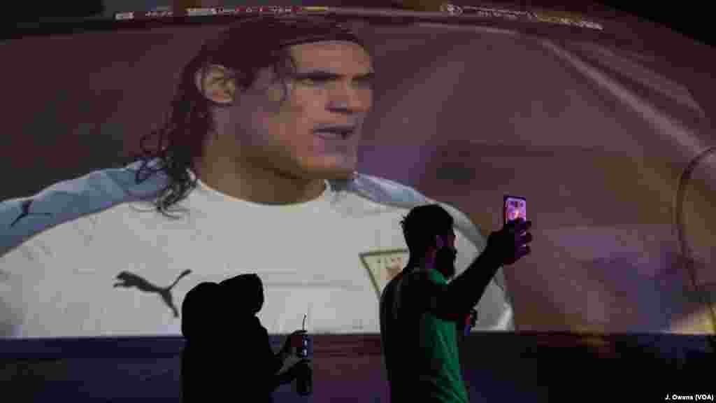 Some fans take selfies outside the dome, a temporary structure previously used for a cultural festival.