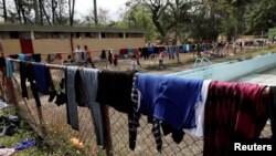 Central American migrants' clothes dry on a fence, as the migrants take a break from traveling in their caravan on their journey to the U.S., in Matias Romero, Oaxaca, Mexico, April 3, 2018.