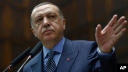 Turkey's President Recep Tayyip Erdogan addresses his supporters at the parliament in Ankara, Turkey, Nov. 28. 2017.
